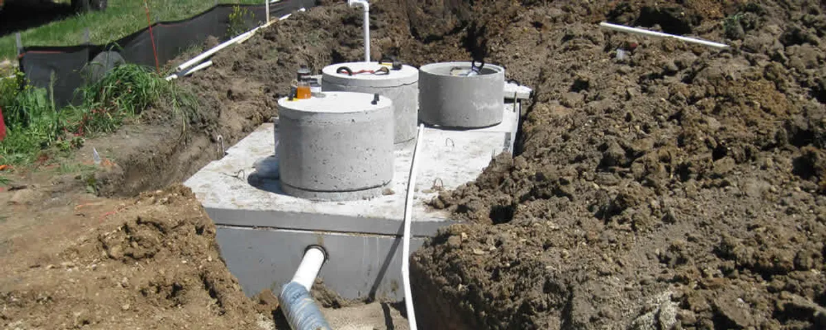 Septic system repair and installation site with tank access ports in Duluth, MN