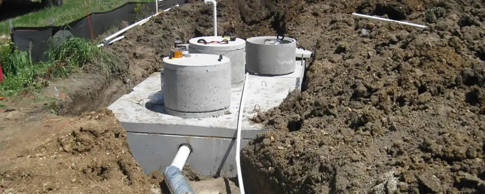 Septic system repair and installation site with tank access ports in Duluth, MN