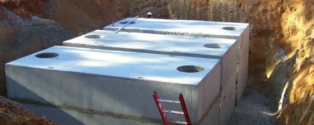 Septic tank installation site with a newly placed concrete tank in Duluth, MN